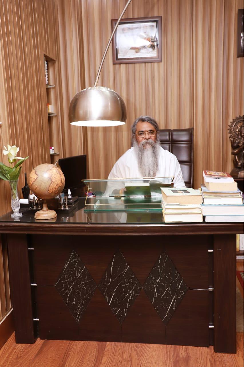 Maharishi Yogi Madhusudan at his desk in his study